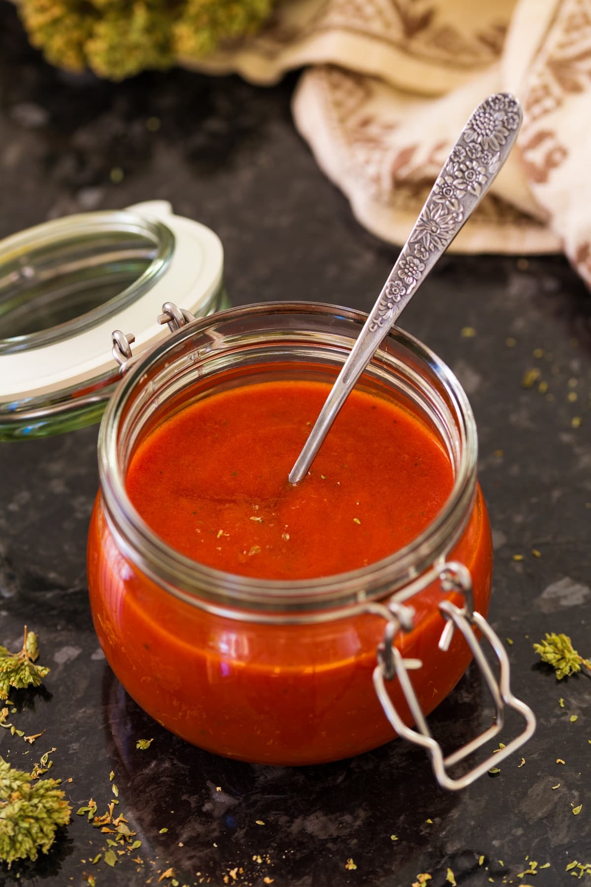 Authentic tomato sauce for pizza in a glass jar.