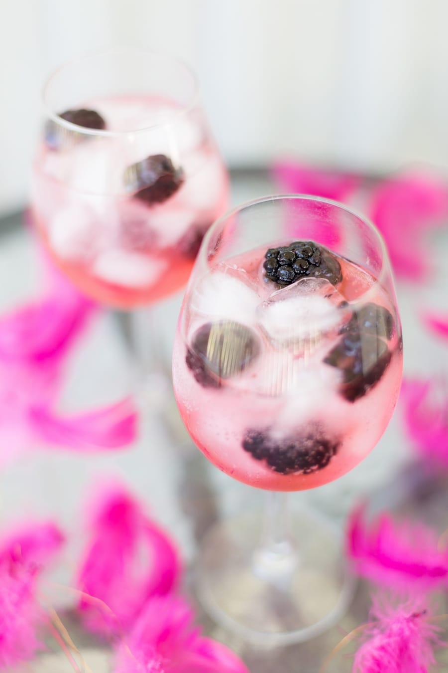 Blackberry gin and tonic with pink tonic water