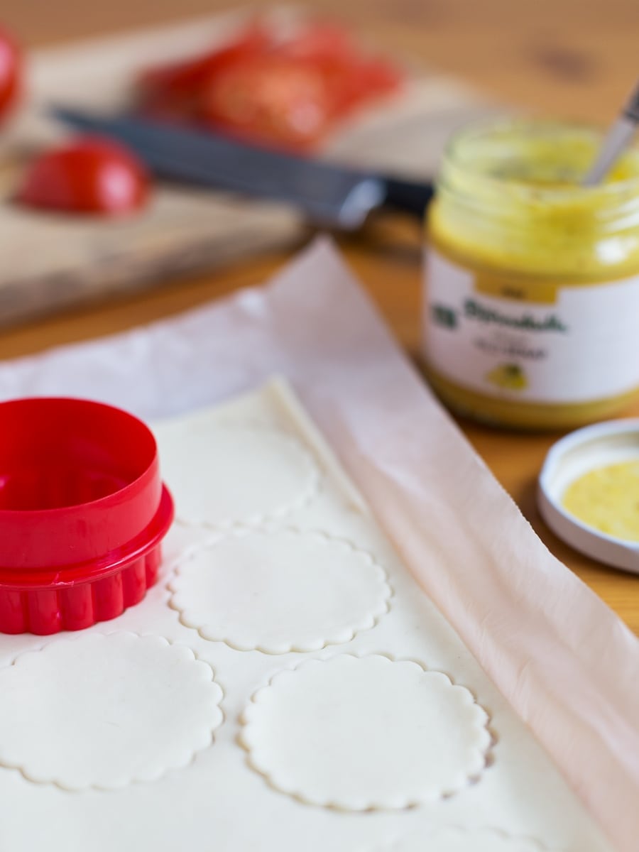 Cutting puff pastry discs.
