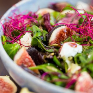 Fig and goat cheese salad, beet sprouts and raspberry vinaigrette