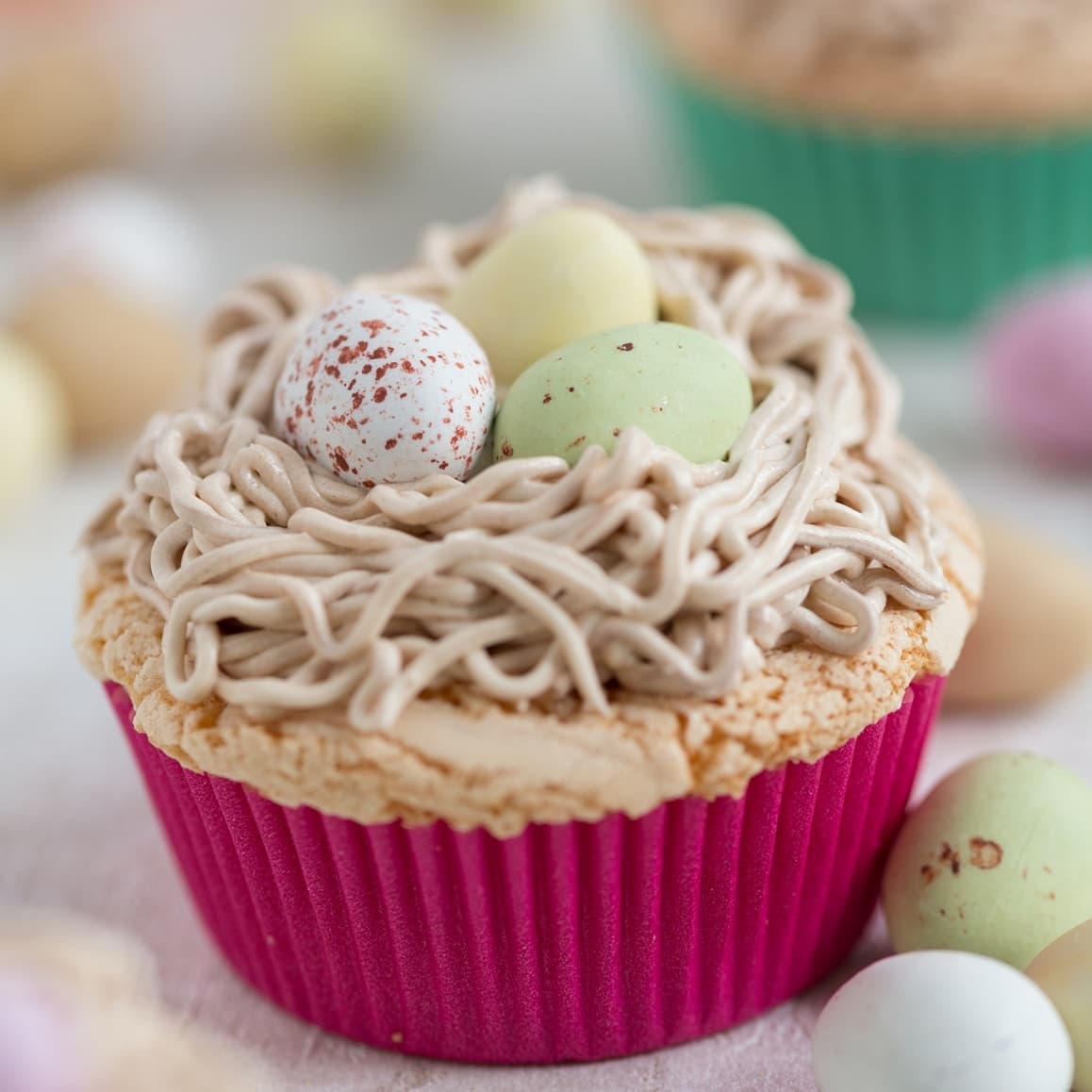 Bird's nest cupcake. Egg cake topped with a buttercream nest and egg chocolates.