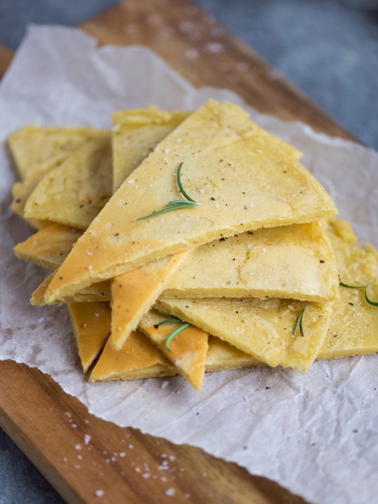 Stacked triangles of farinata with rosemary