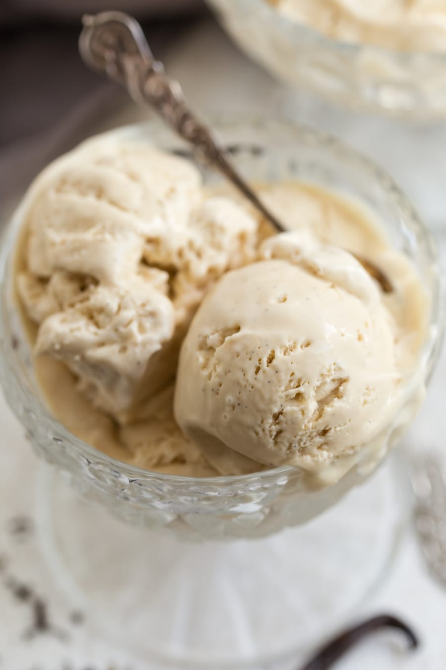Closeup of London fog ice cream, portioned in a glass bowl.