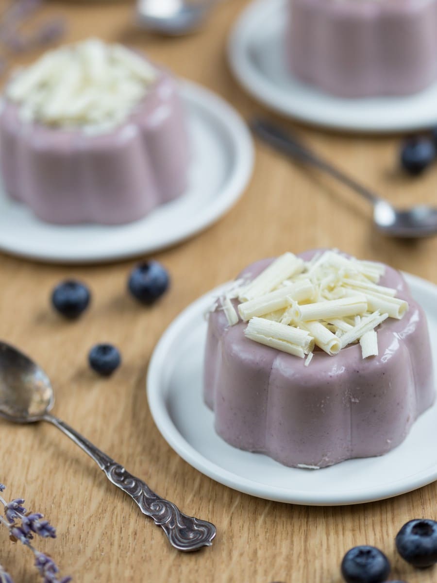 Blueberry lavender panna cotta with white chocolate shavings on top.
