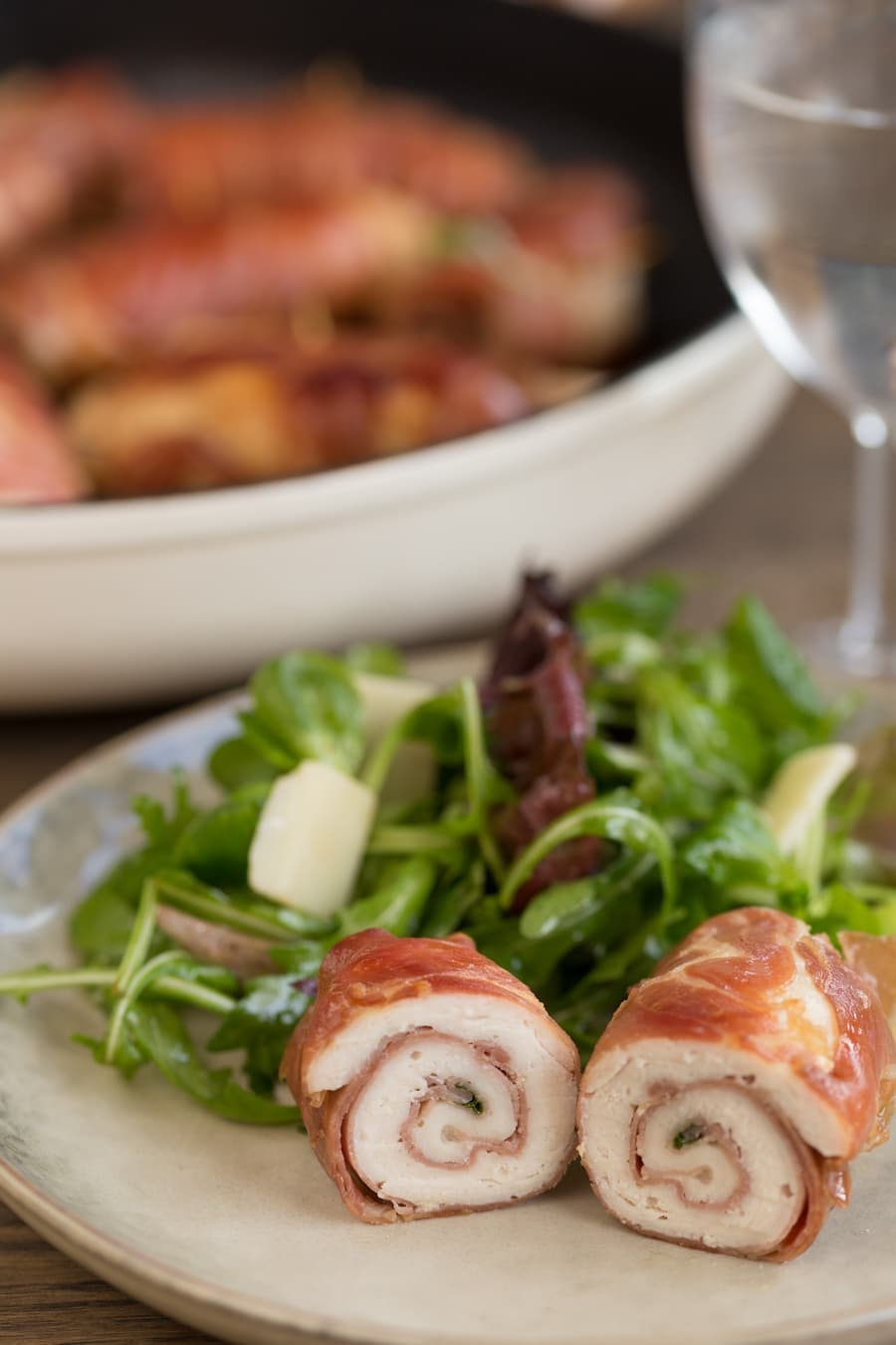 Chicken involtini serving suggestion: with a green salad and parmesan flakes.
