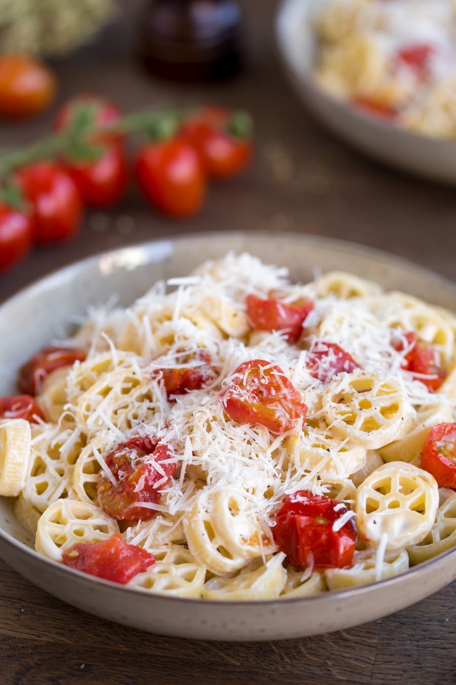 Closeup of roasted cherry tomato pasta.