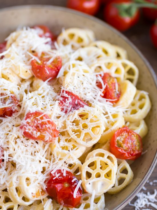 Oven-roasted cherry tomato pasta closeup.
