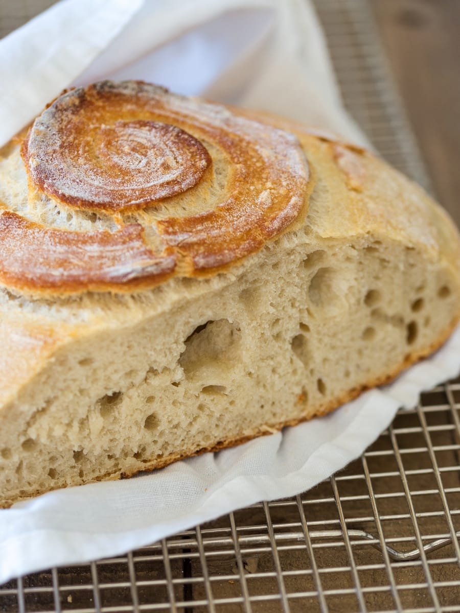 Sourdough bread sliced to show airy texture.