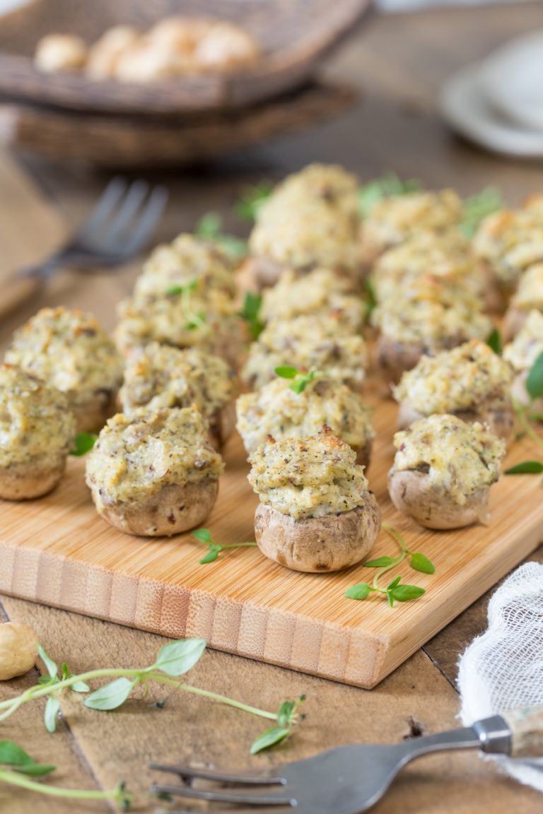 Baked vegetarian stuffed mushrooms decorated with fresh thyme.