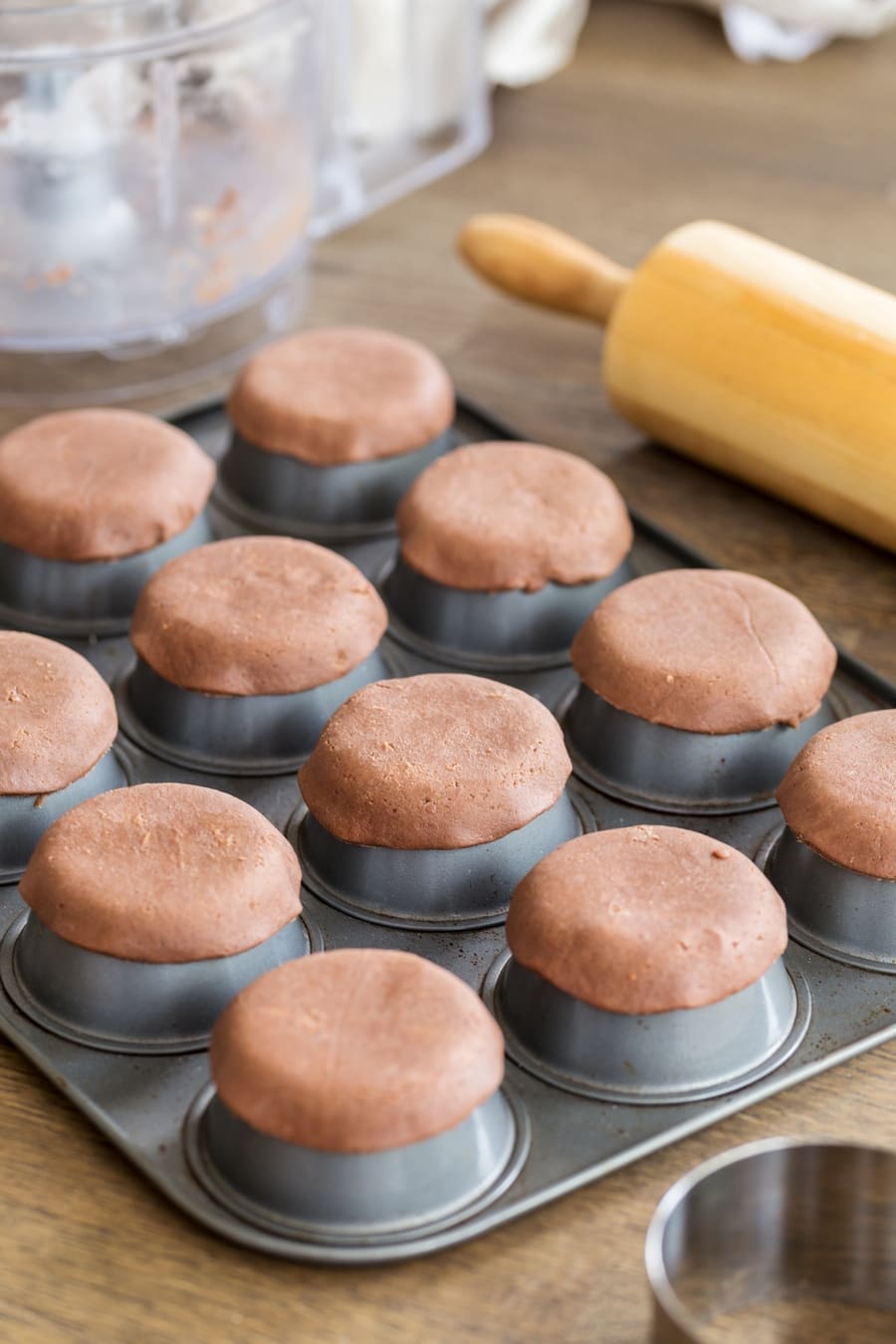 Shortcrust pastry circles baked over upside down muffin tin to make small shortcrust shells.