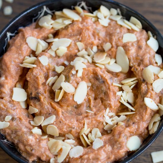 Eggplant ricotta dip garnished with roasted shaved almonds.