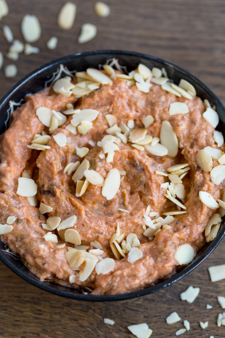 Eggplant ricotta dip garnished with roasted shaved almonds.