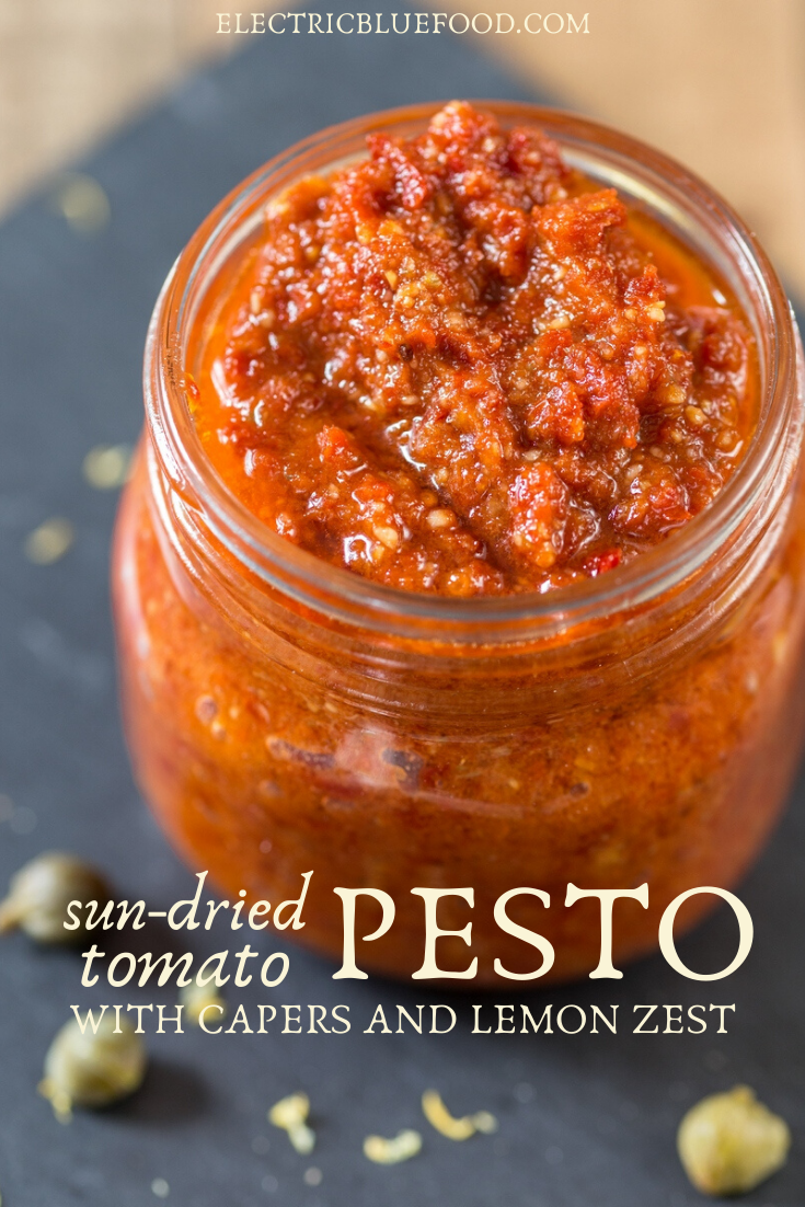 Vegan sun-dried tomato pesto with capers and lemon zest. A refreshing and flavourful pesto that works great as a spread or as pasta sauce. It is entirely vegan and very easy to make.