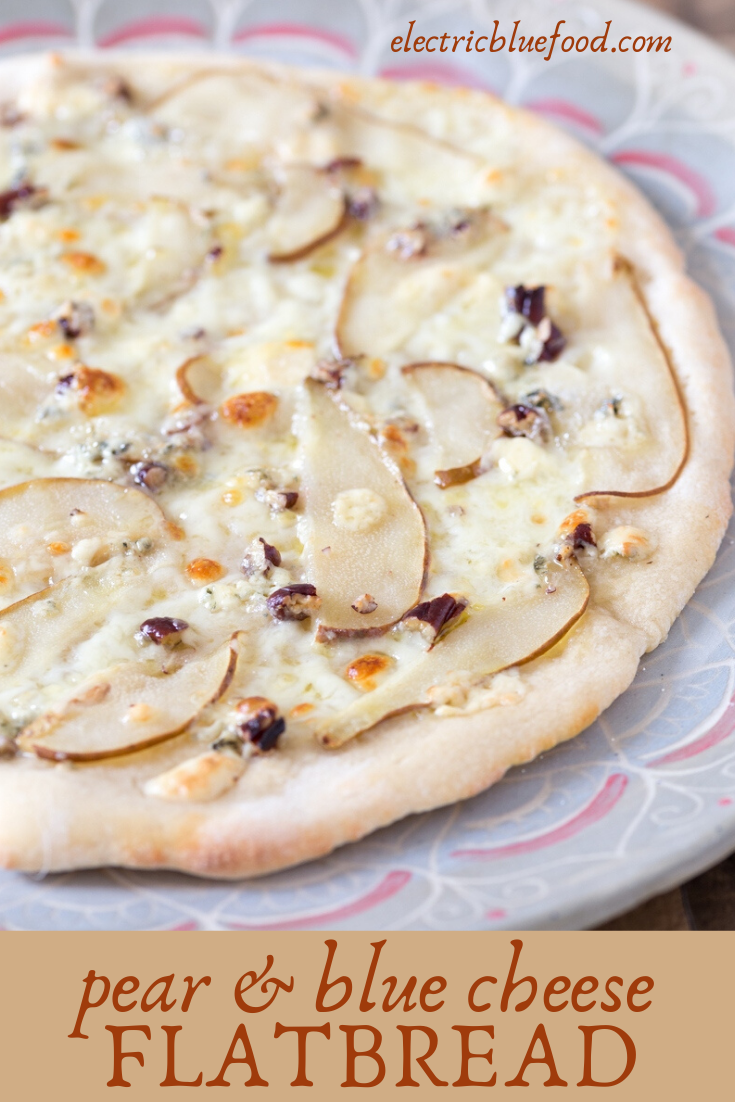 Ripe pear slices and delicious blue cheese top this pear and blue cheese pizza bianca. Topped with pecans and with unmissable mozzarella, this gourmet pizza goes well as both main and dessert!