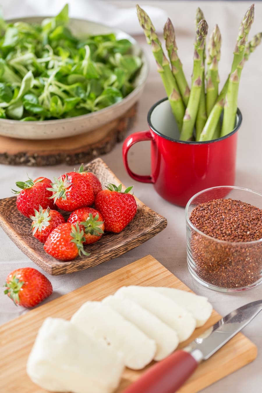 Red quinoa, halloumi, strawberries, asparagus and green salad leaves.
