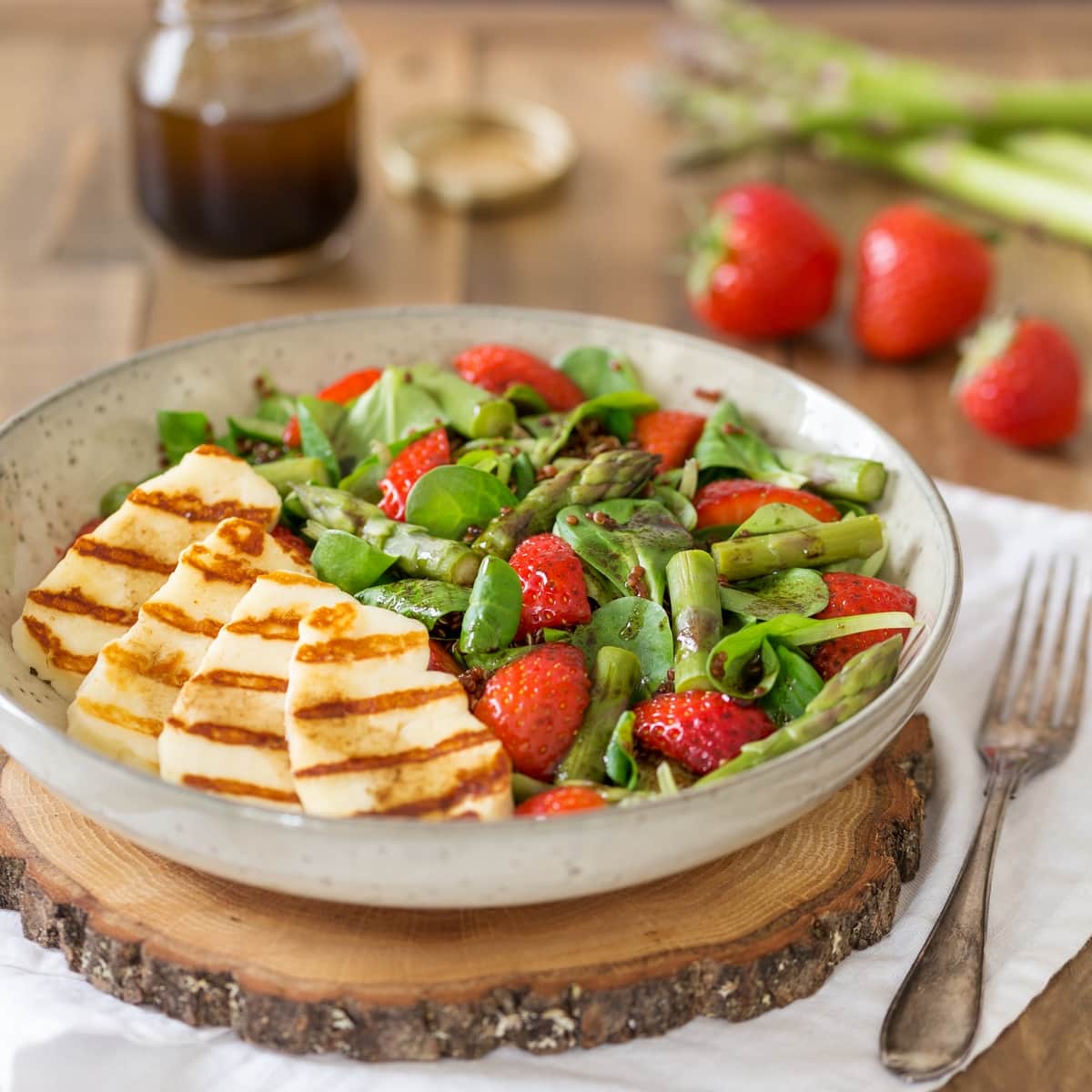 Halloumi salad with asparagus, strawberries and quinoa.