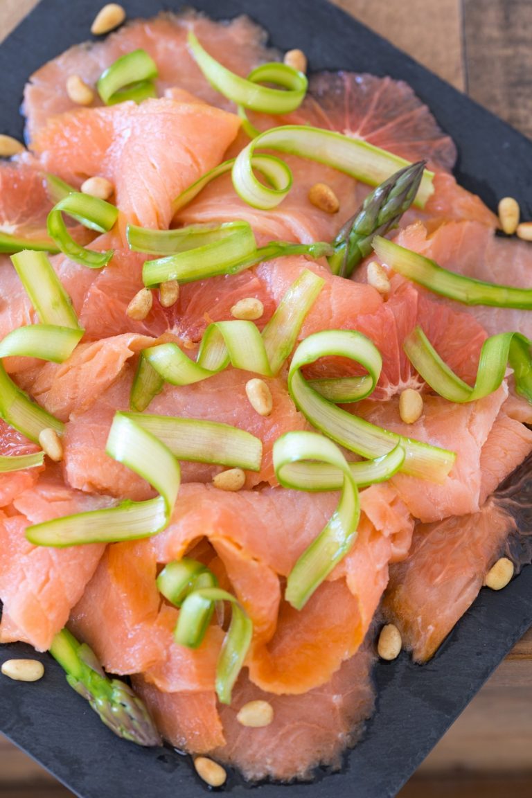 Smoked salmon carpaccio with grapefruit and shaved asparagus.
