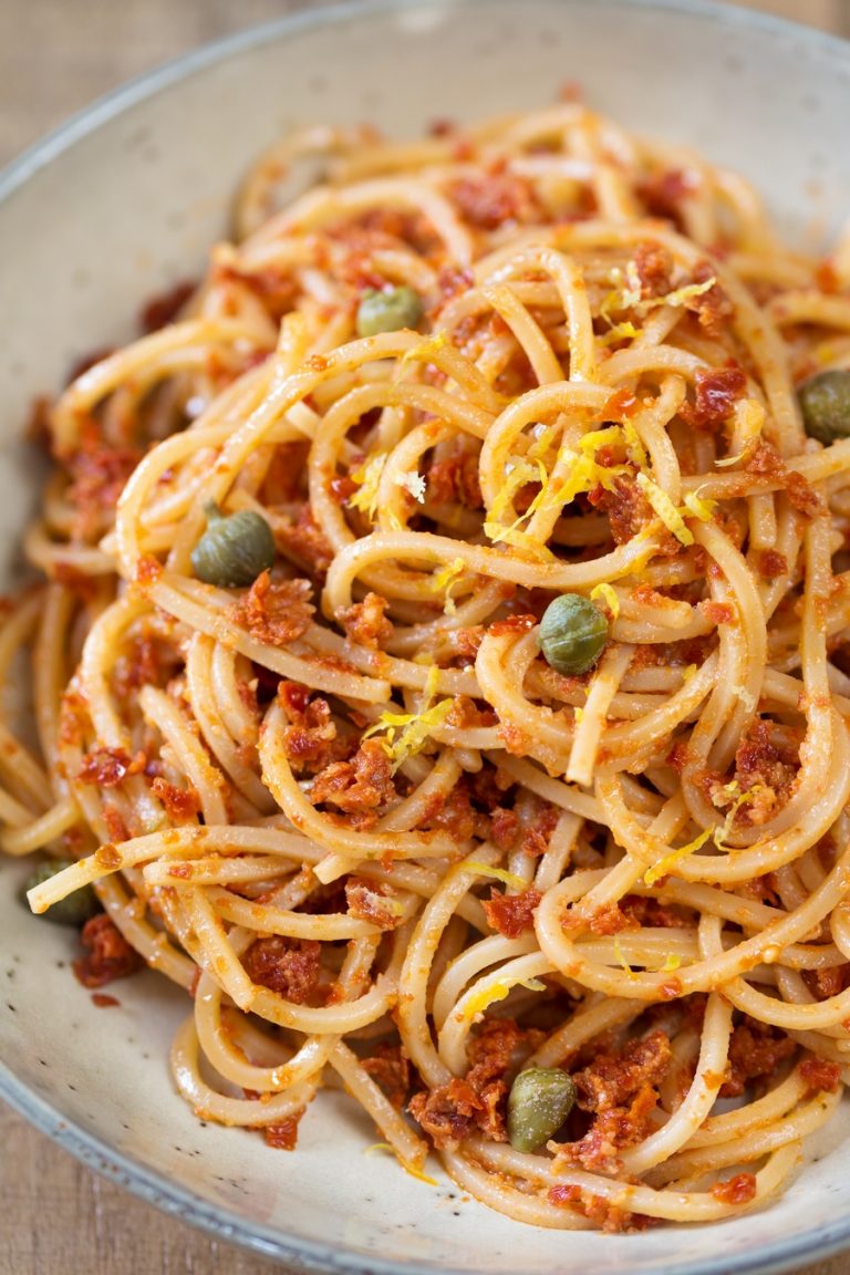 Spaghetti alla chitarra with red pesto, capers and lemon zest.
