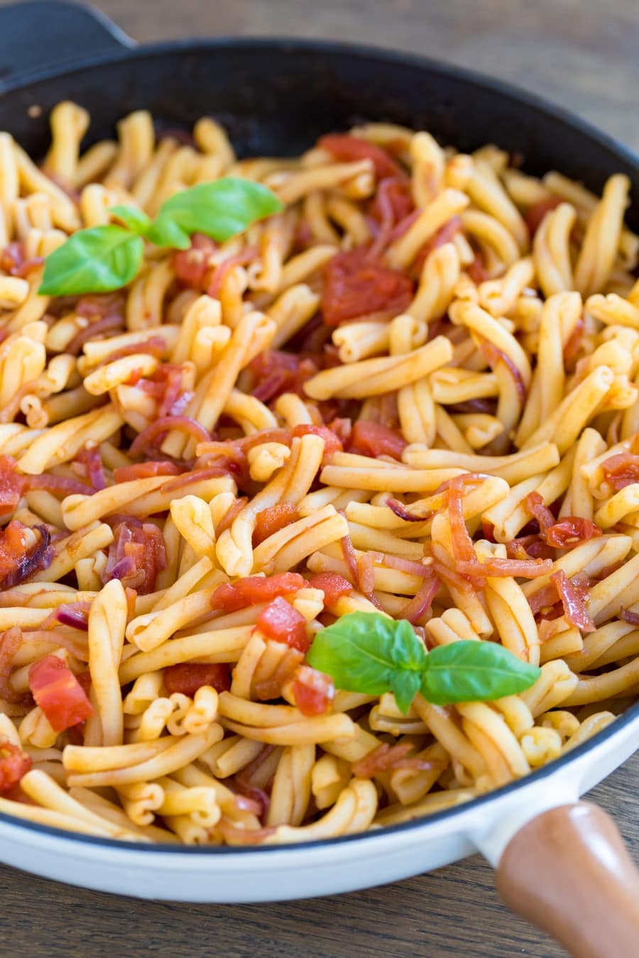 Strozzapreti pasta with balsamico onion pasta sauce with fresh tomatoes.