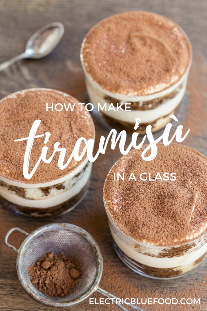 Homemade tiramis in a glass. Small portion tiramisù served in individual glasses. Tiramisù made with sponge cake as single-serve portions.