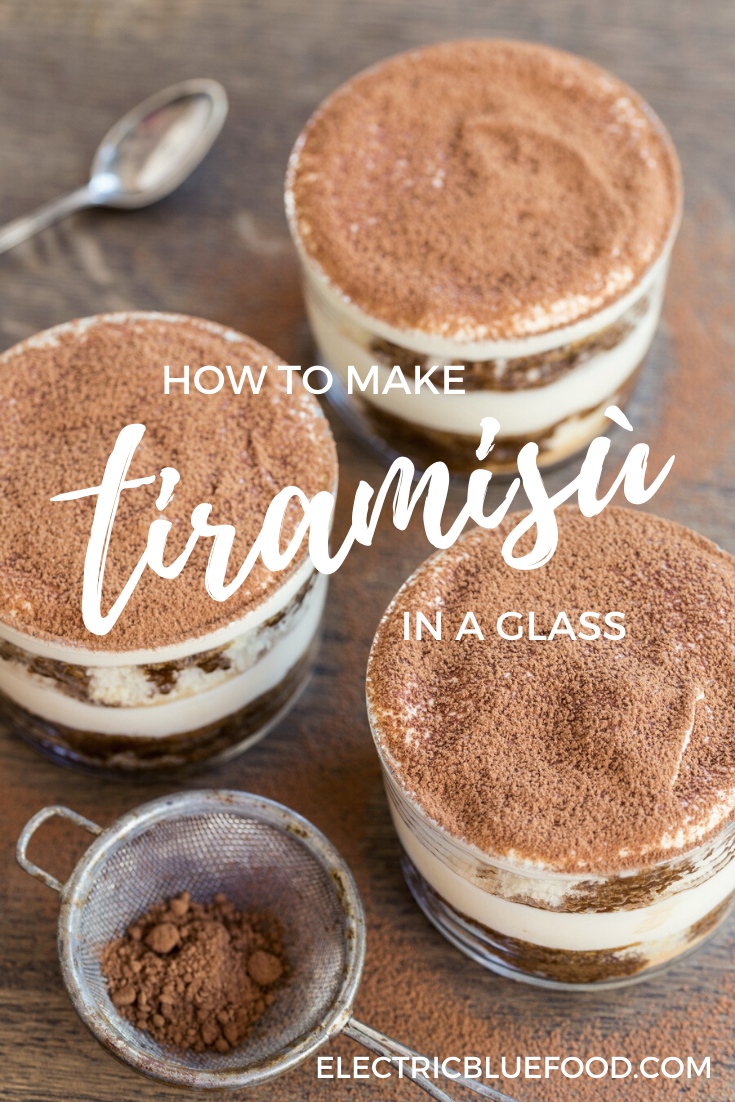 Homemade tiramis in a glass. Small portion tiramisù served in individual glasses. Tiramisù made with sponge cake as single-serve portions.