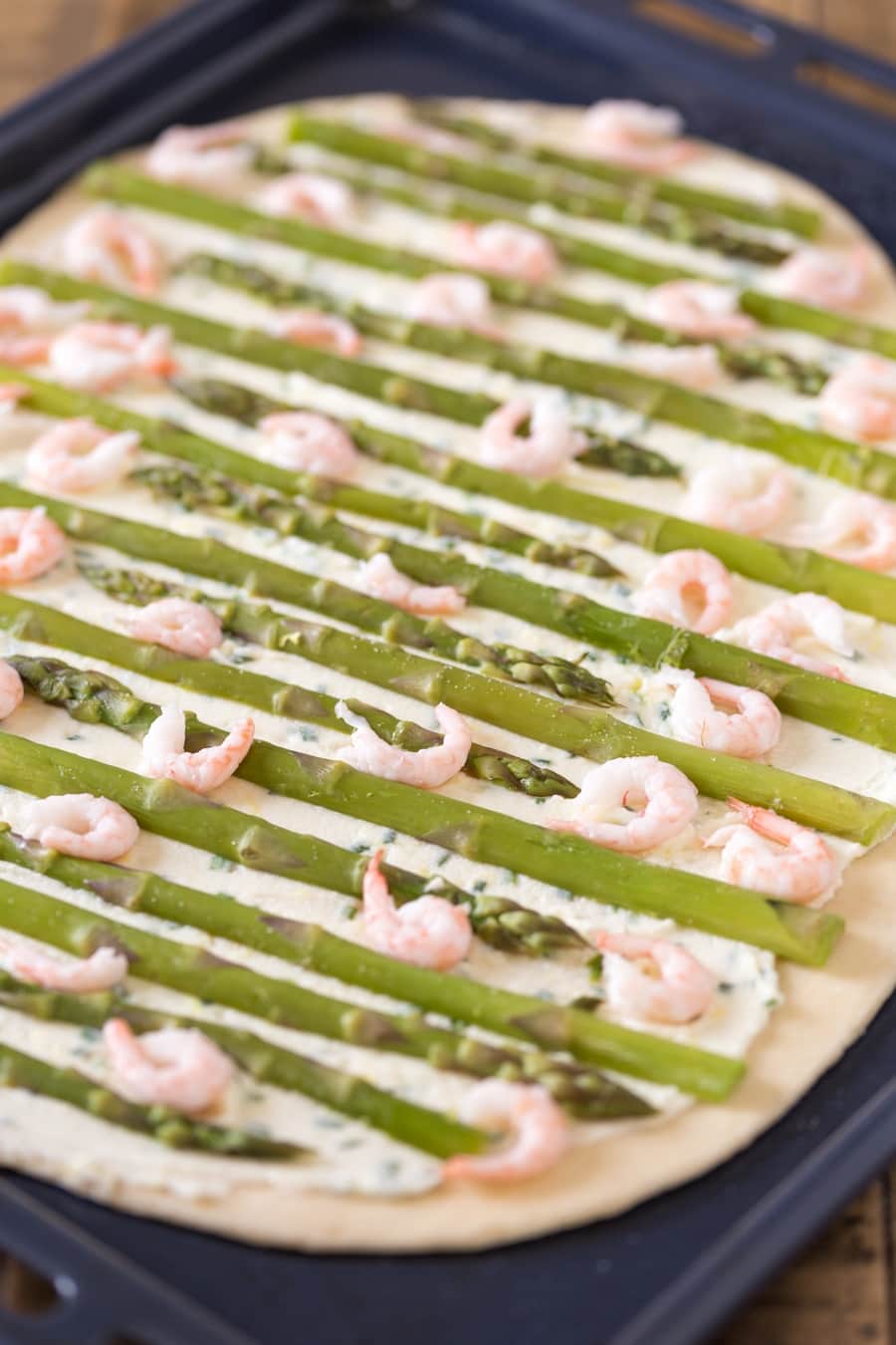 Shrimps and asparagus topping mascarpone flatbread.