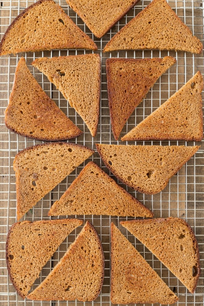 Toasted rye bread slices.