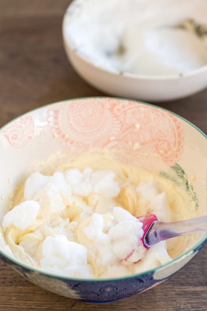 Folding egg whites into mascarpone cream.