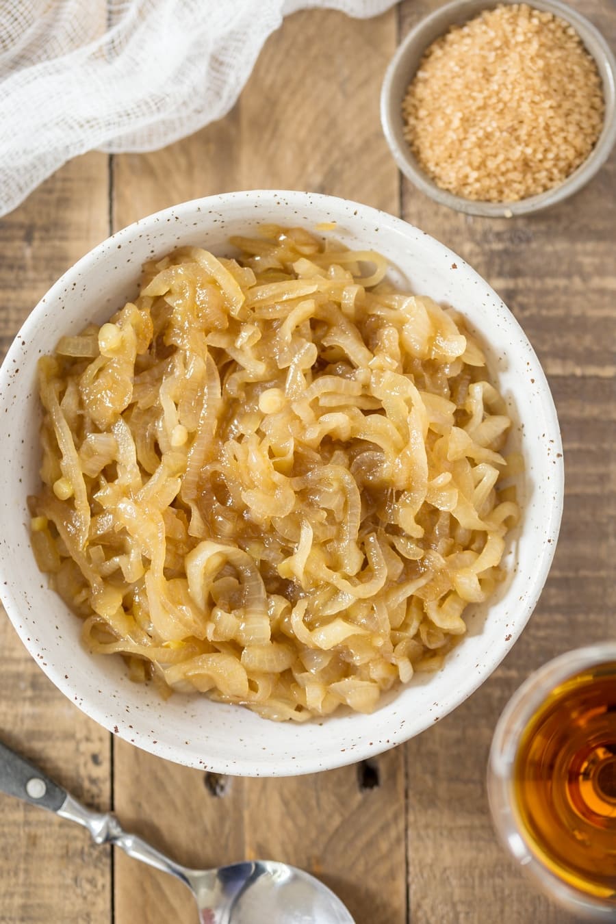 Overhead view of marsala caramelized onions in a bowl.