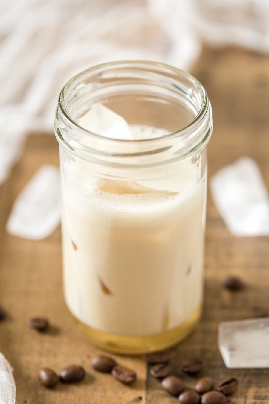 Oat milk with vanilla syrup and ice cubes: cold brew coffee to be added.