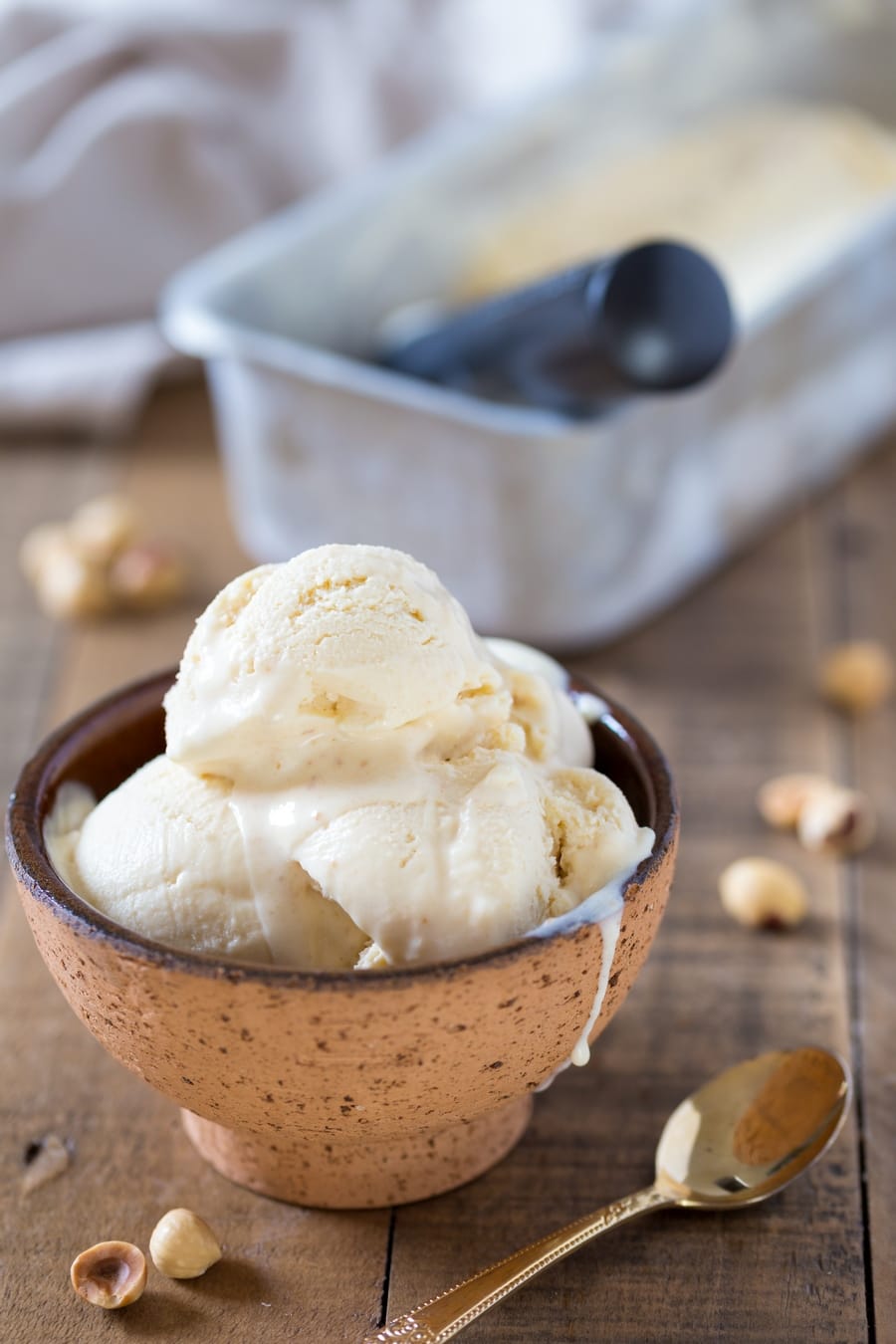No-churn hazelnut ice cream served in a brown bowl.