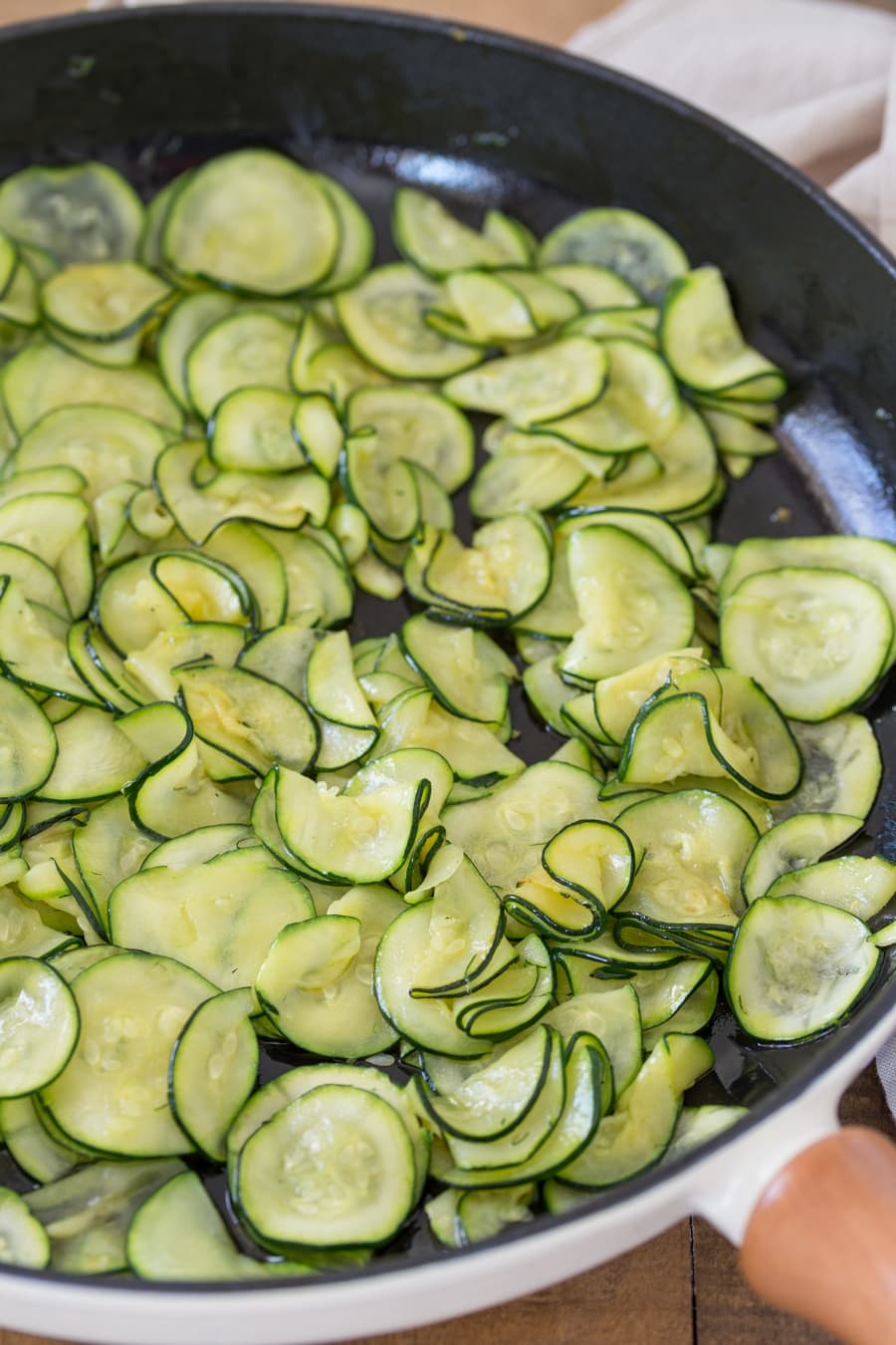 Pan-fried zucchini, thinly sliced.