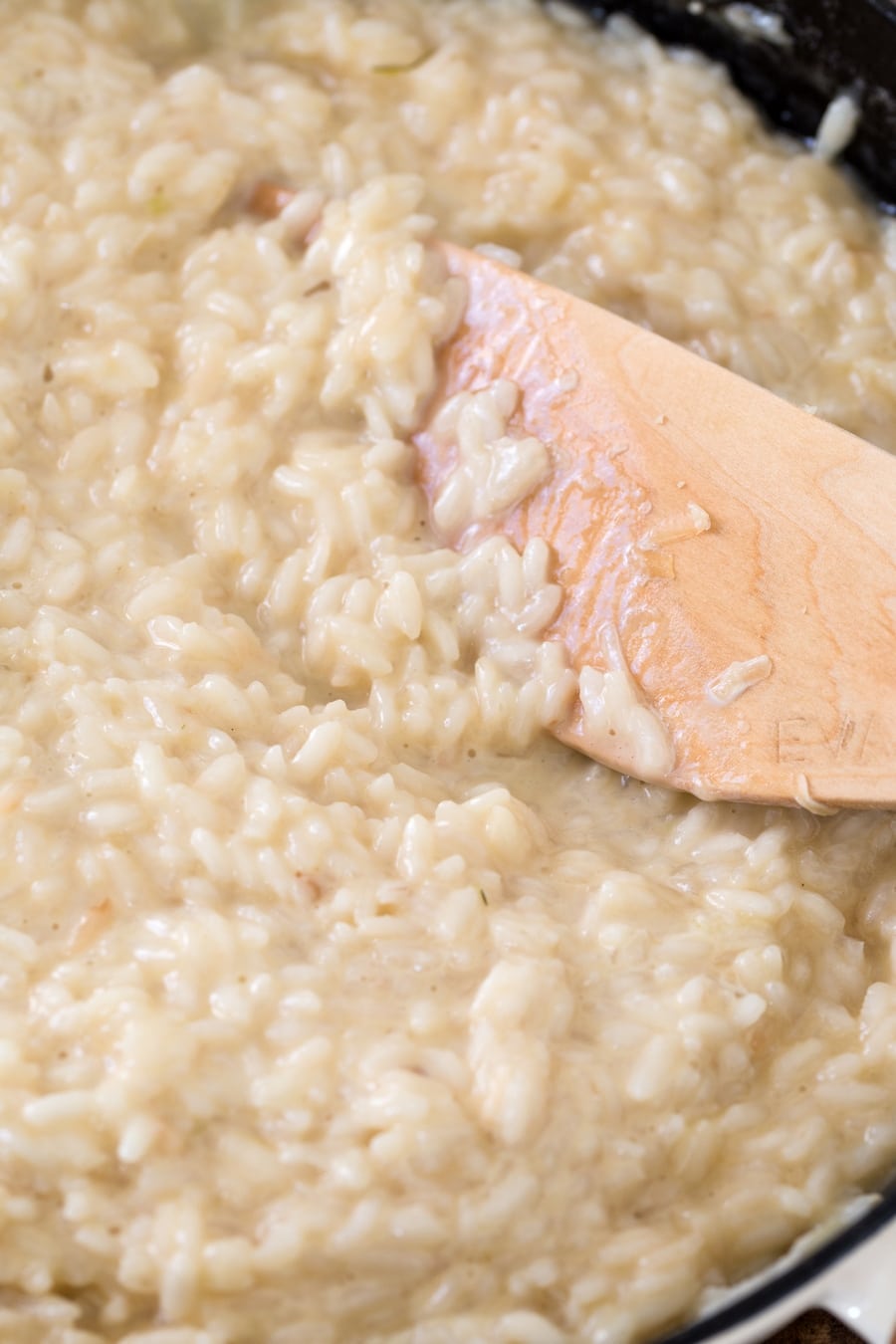 Closeup of fluffy consistency of cheddar risotto.
