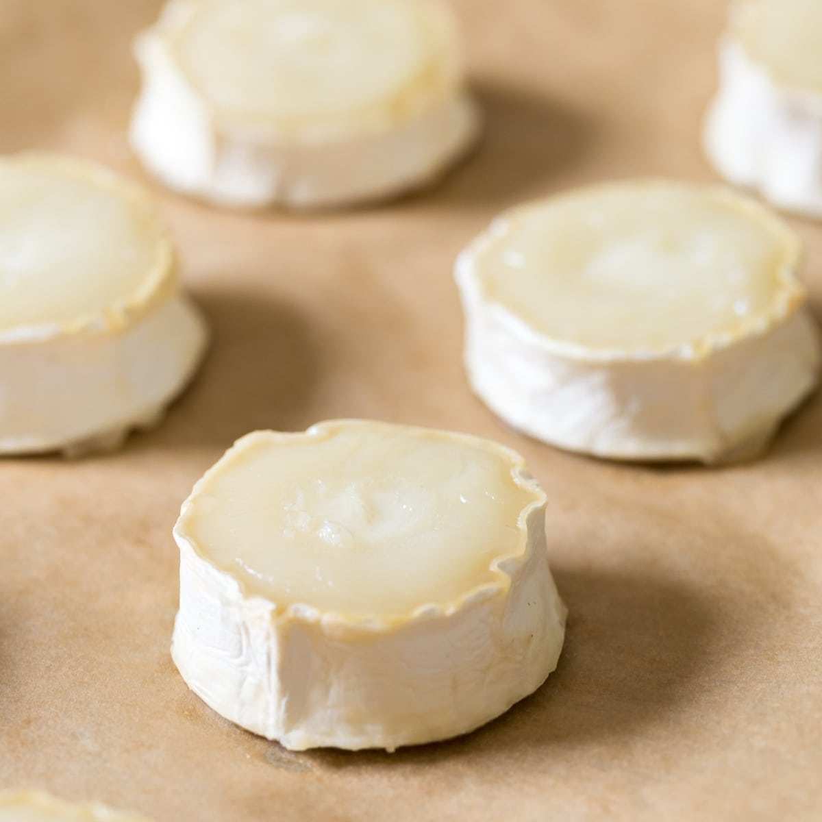 Baked goat cheese log slices.