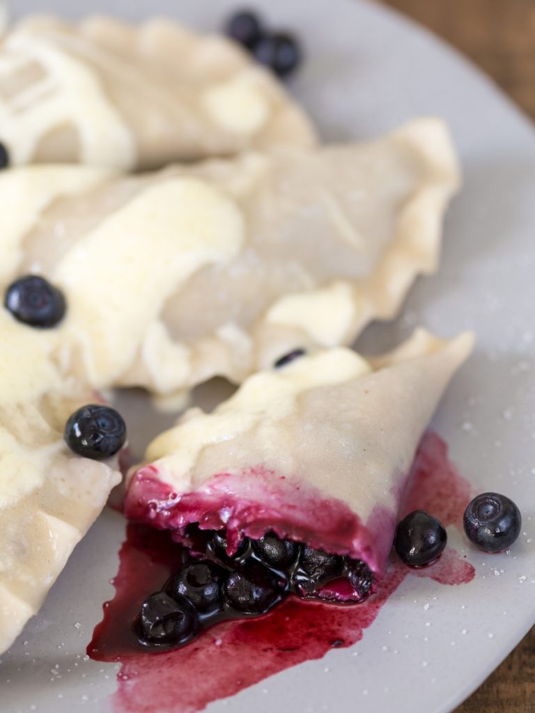 Blueberry pierogi showing the filling after cooking.