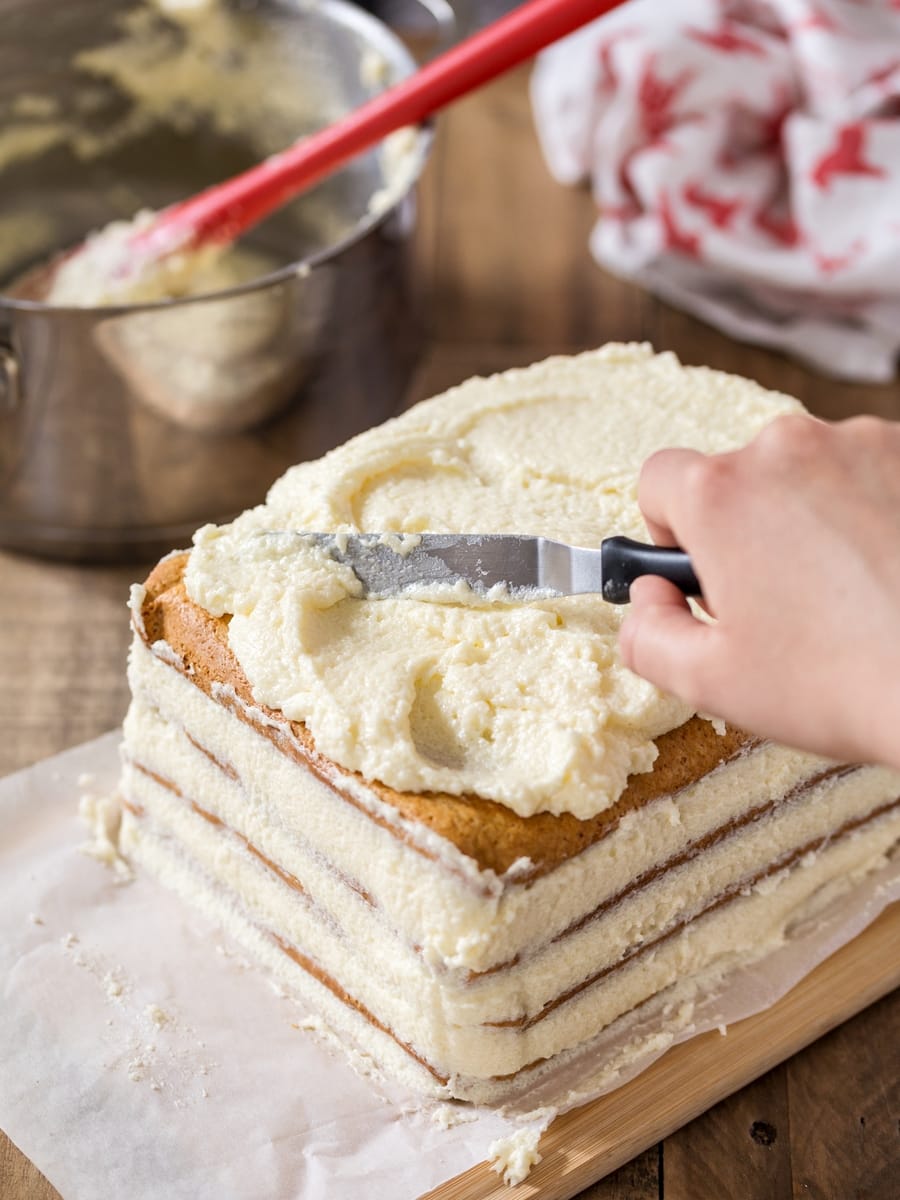 Semolina cream spread over top of honey cake.