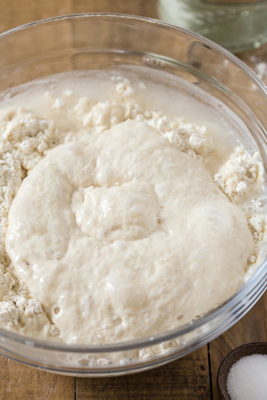 Making poolish focaccia: combining flour, water and poolish.