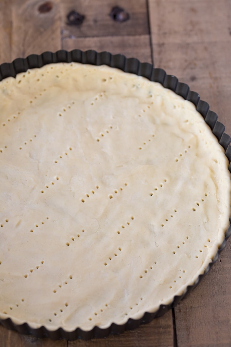 White wine shortcrust pastry pressed into tart pan.