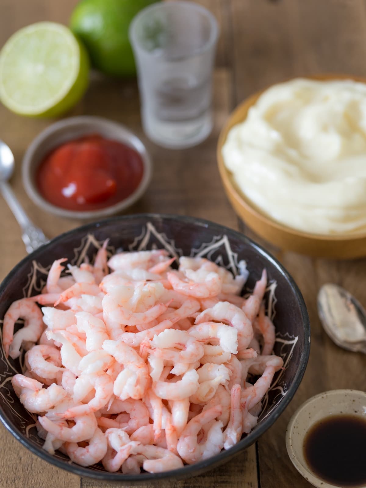 Ingredients to shrimp in cocktail sauce.