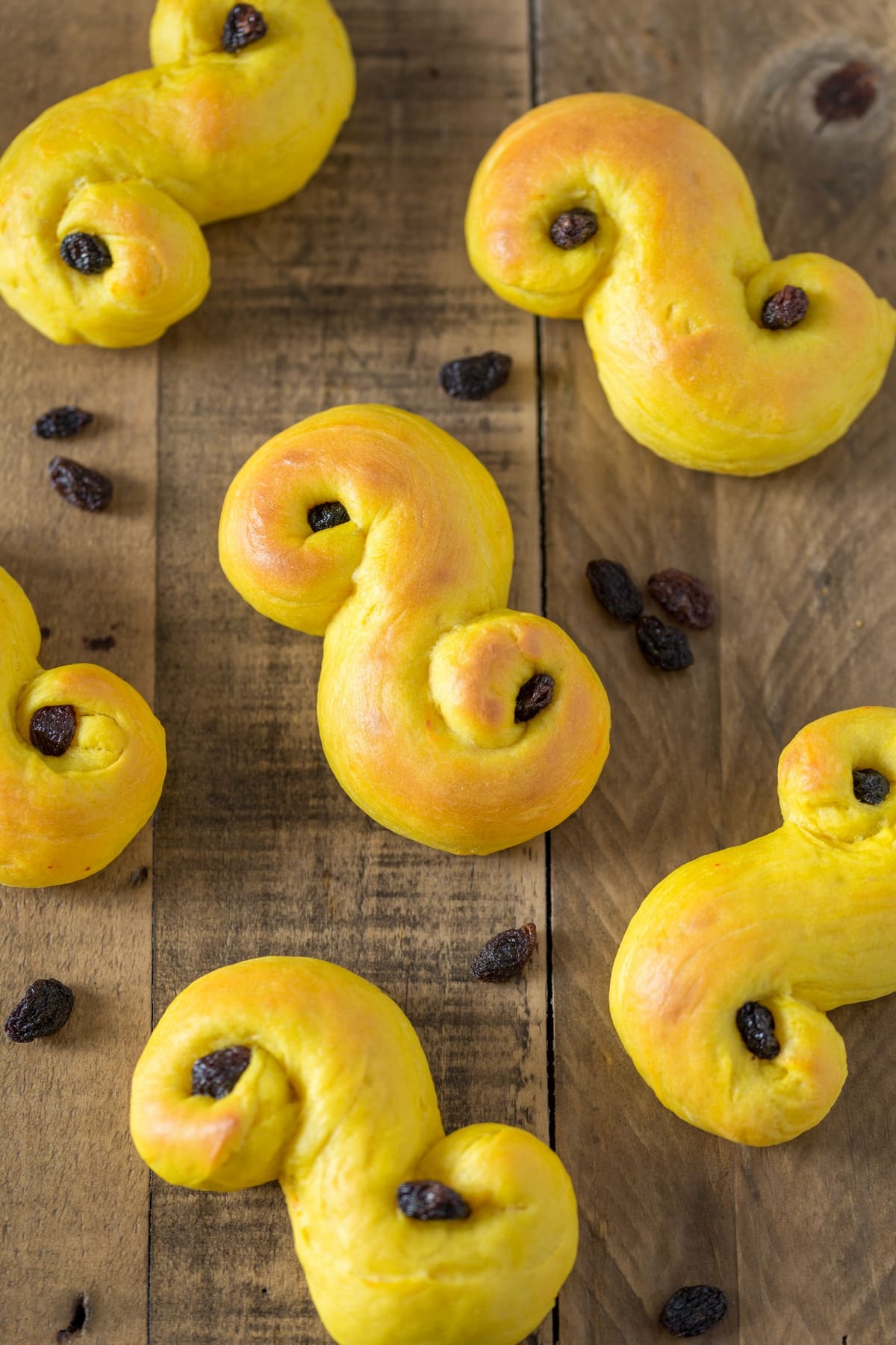 Overhead view of saffron buns on a table.
