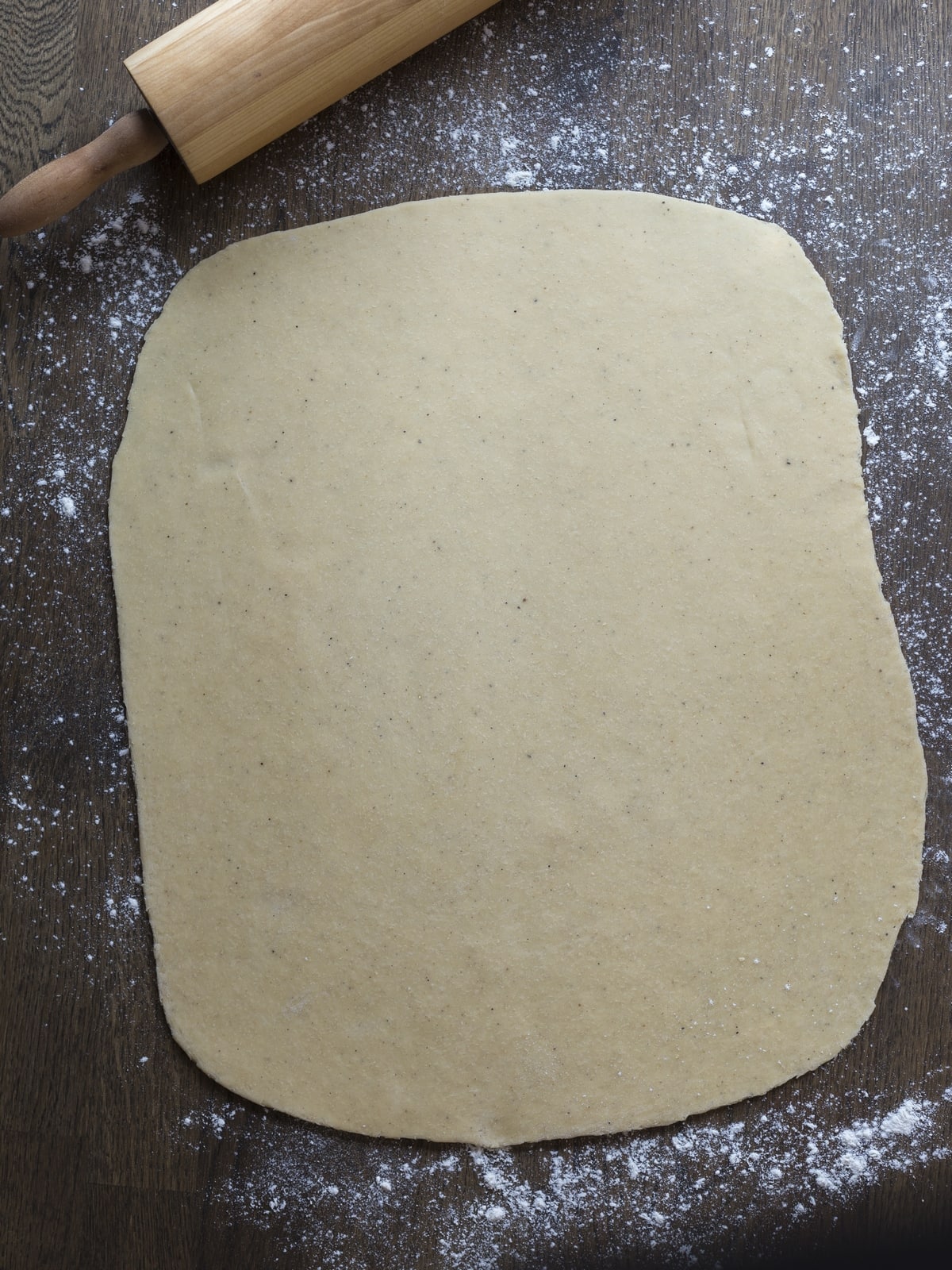 Cinnamon bun pastry rolled out.