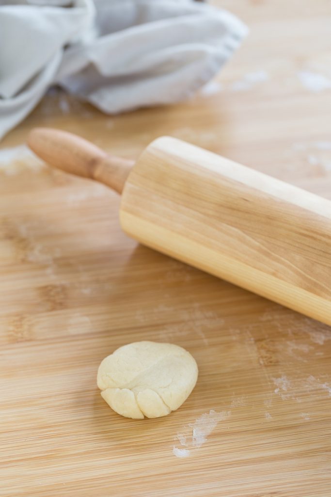 Dough ball to be flattened with a rolling pin.