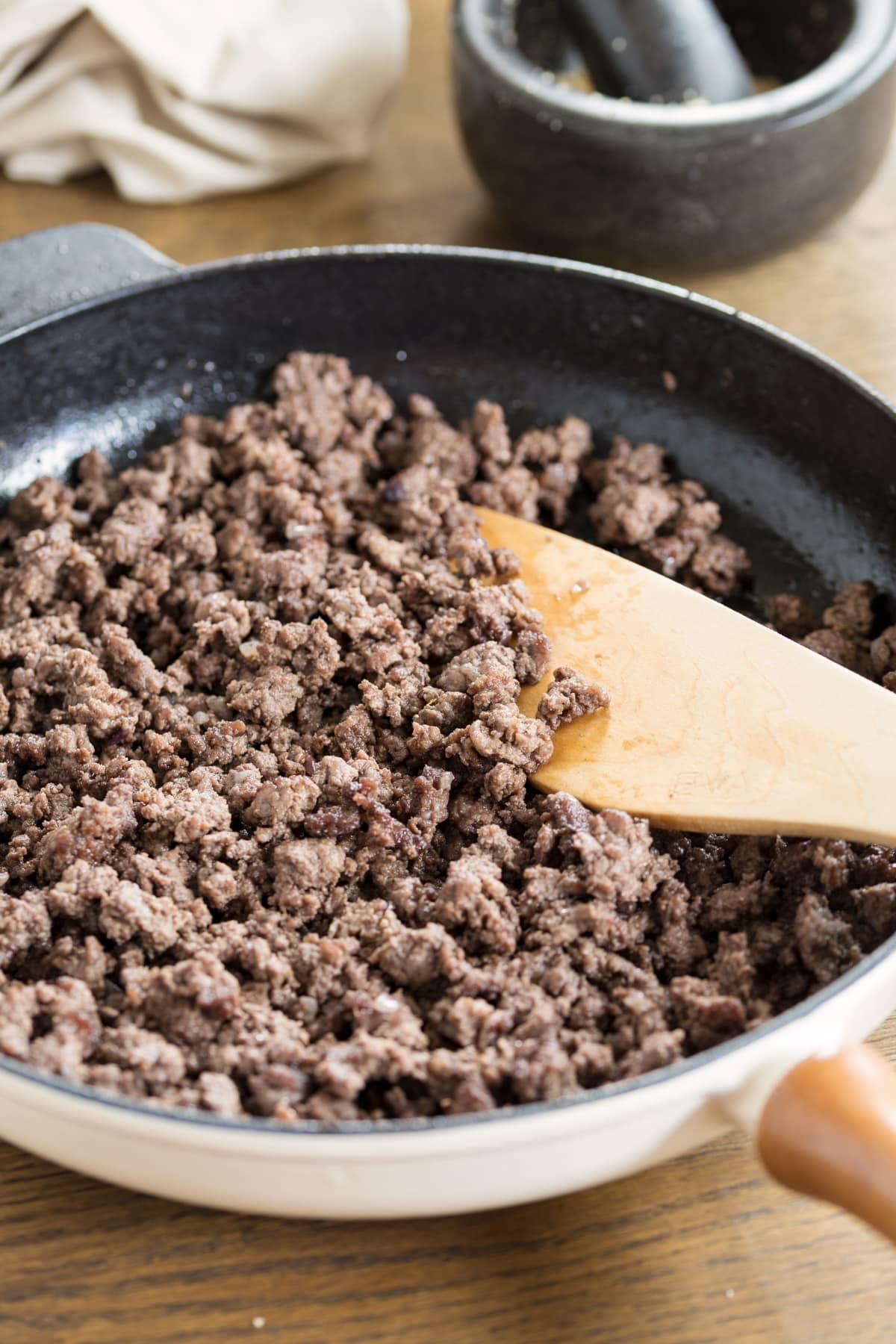 Ground venison cooked in a skillet.