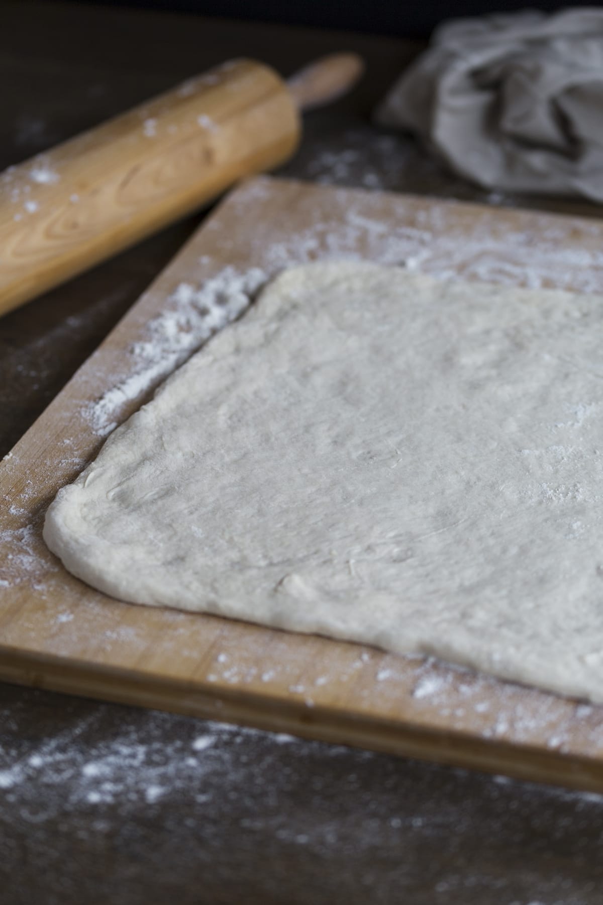 Rolled out dough on a working surface.