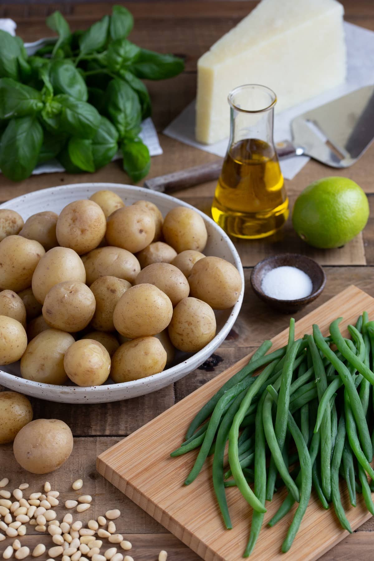 Baby potatoes with green beans and other ingredients needed for the recipe.