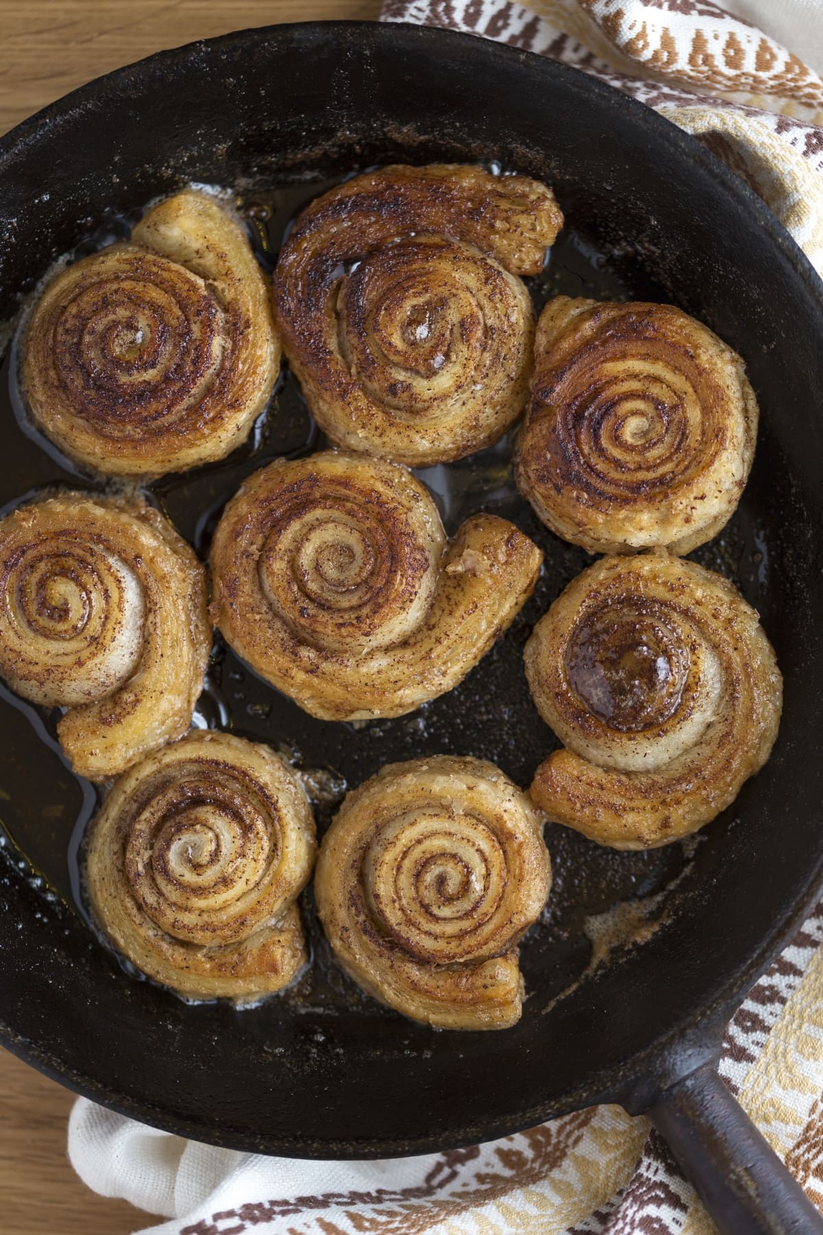 Skillet cinnamon rolls made with puff pastry.