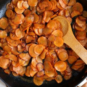 Butter sauteed carrots in cast iron pan.
