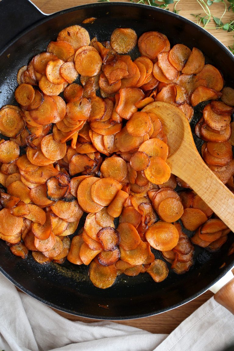 Butter sauteed carrots in cast iron pan.