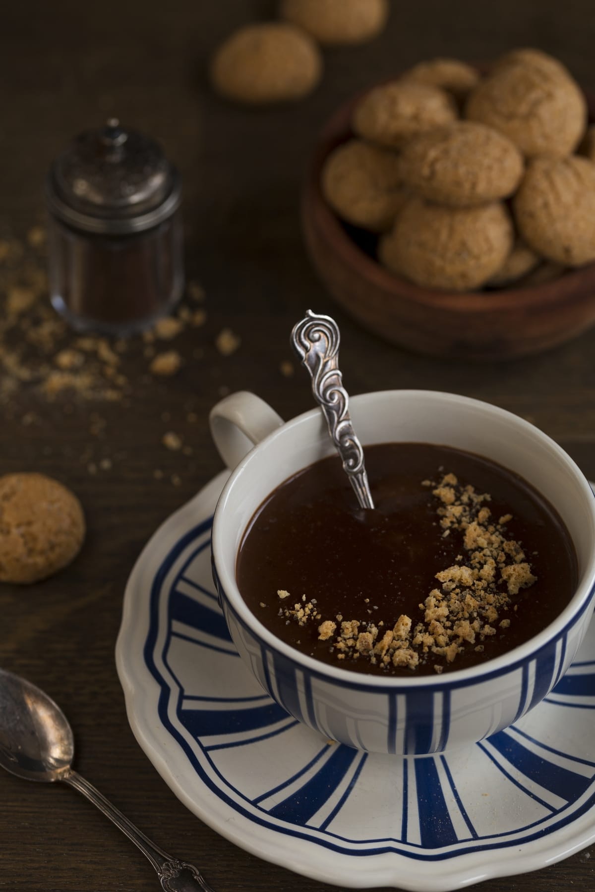 Thick hot chocolate with crushed amaretti cookies on top.