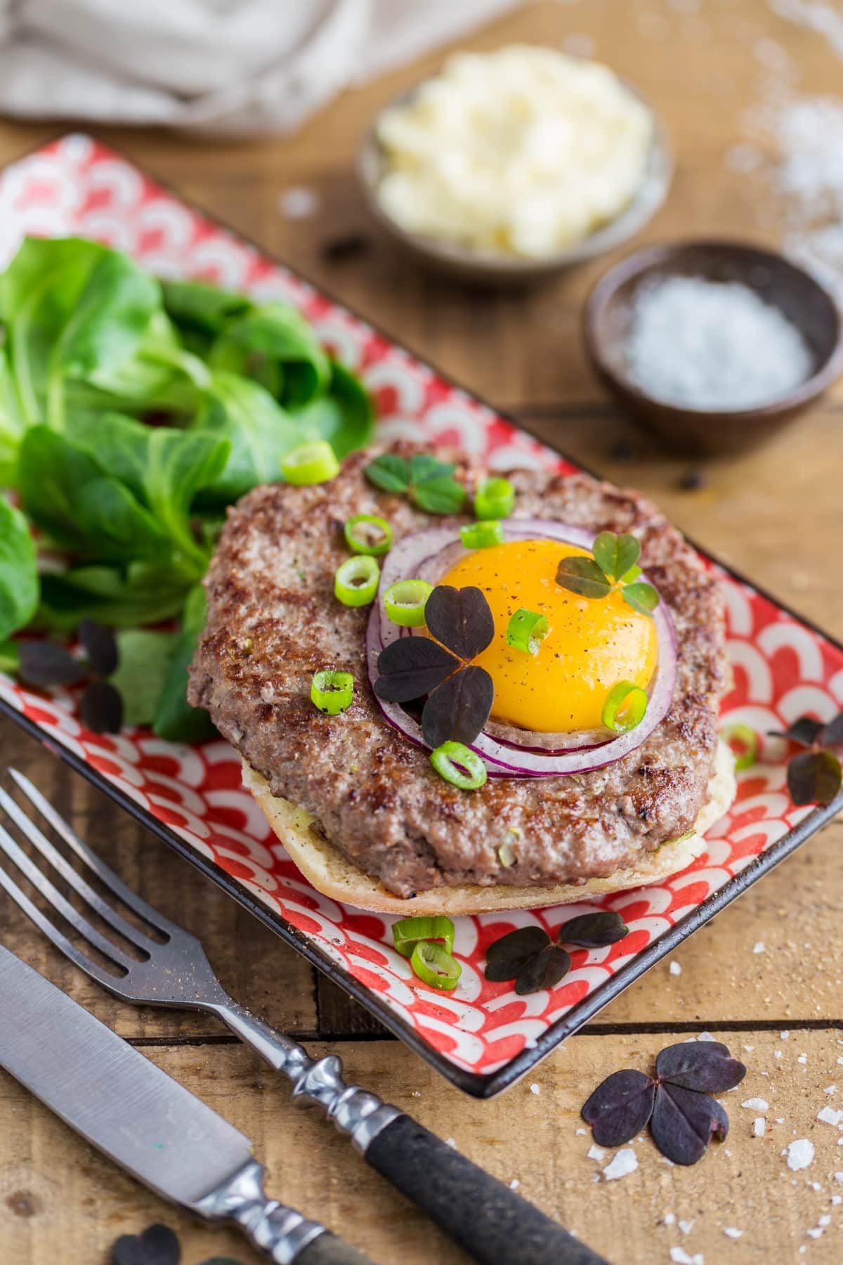 Open-faced beef patty sandwich inspired by Danish smørrebrød.